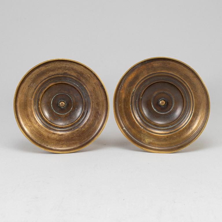 A pair of ormolu candlesticks, first half of the 19th century.