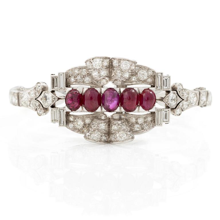 A bracelet platinum set with old- and baguette-cut diamonds and cabochon-cut rubies, circa 1930-40s.