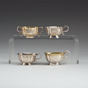 720. Four Russian 18th century parcel-gilt vodka-cups, three unmarked.