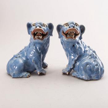 A pair of Chinese 19th century glazed Fo-dogs.