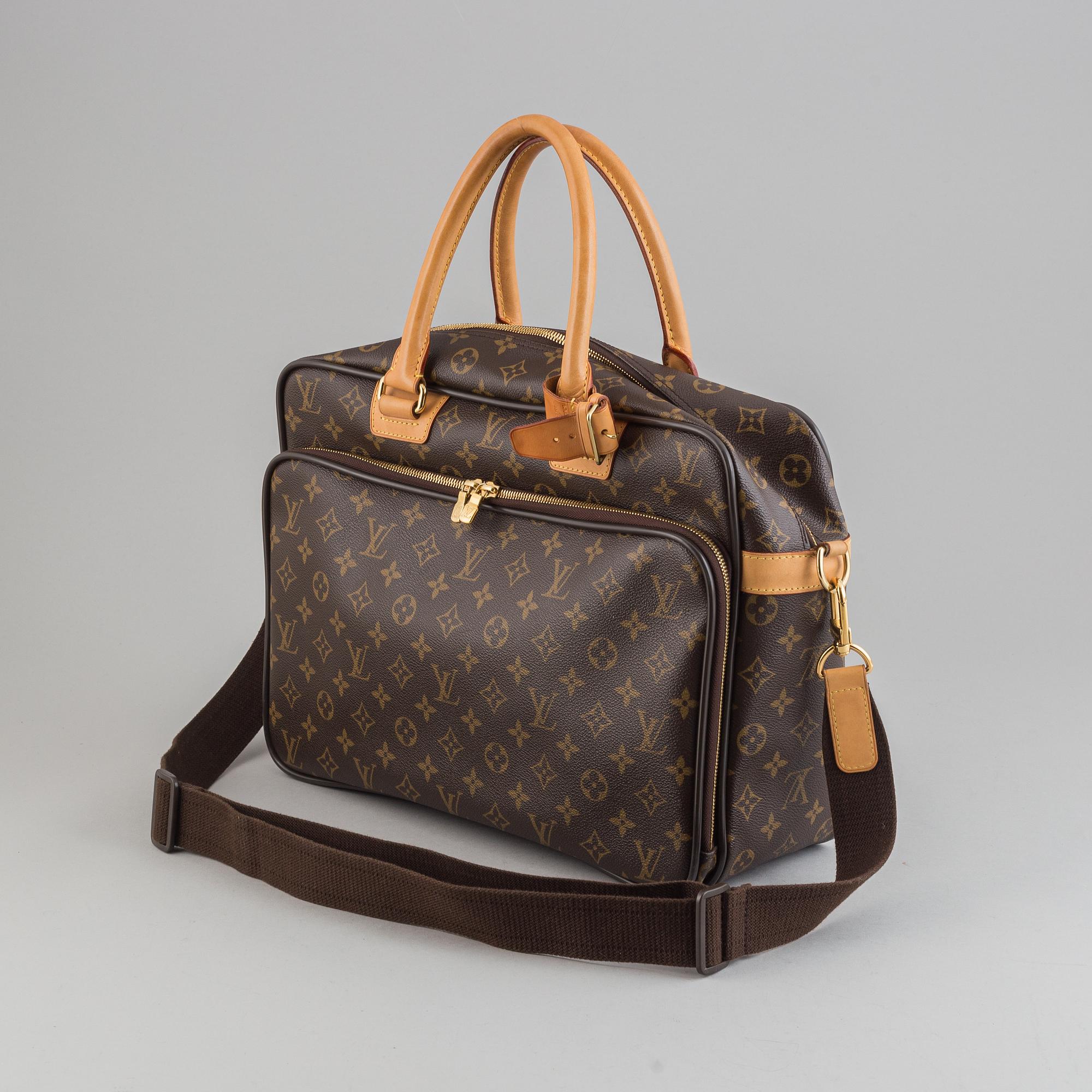Louis Vuitton, a monogram canvas carry on bag.