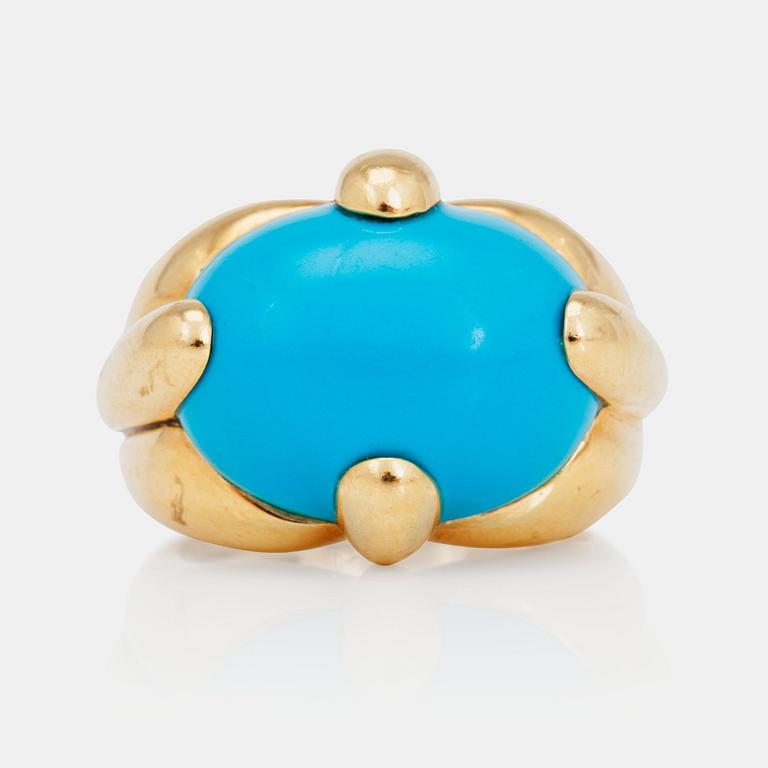 A cabochon-cut turquoise ring.