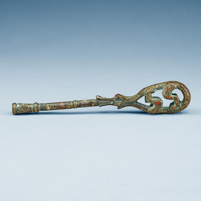 An archaistic tuning key for a Qin instrument.