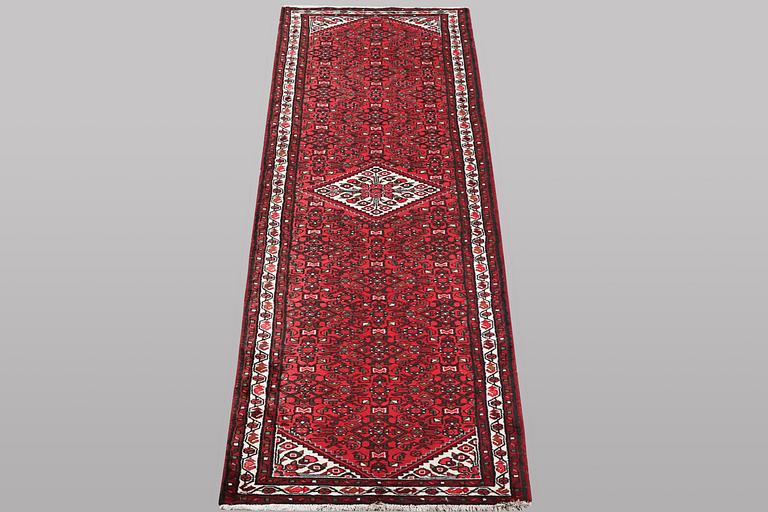 A runner carpet, Hosseinabad, ca 393 x 82 cm.