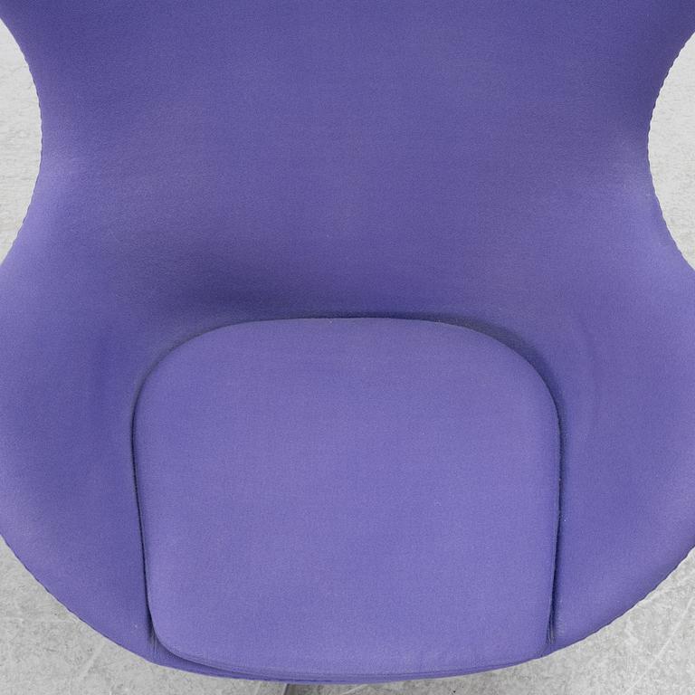 Arne Jacobsen, an armchair with footstool, "The Egg", Fritz Hansen, Denmark, 2003.