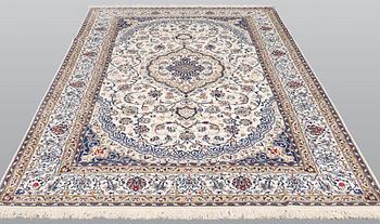 A carpet, Nain Part silk, 312 x 207 cm.