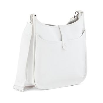 HERMÈS, a white leather shoulderbag, "Evelyn".