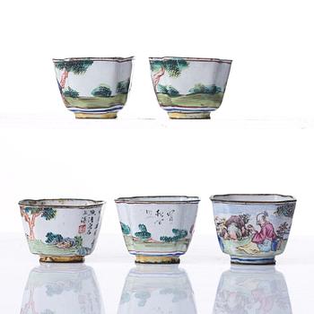 A set of five enamel on copper tea cups and a dish, Qing dynasty, circa 1800.