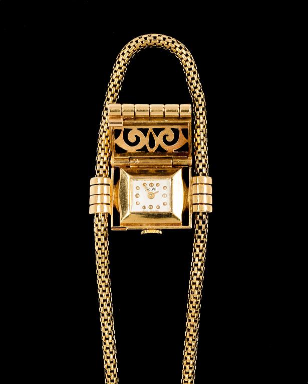 A Solvil ladie´s wrist watch 18k gold and brilliant cut dimonds.