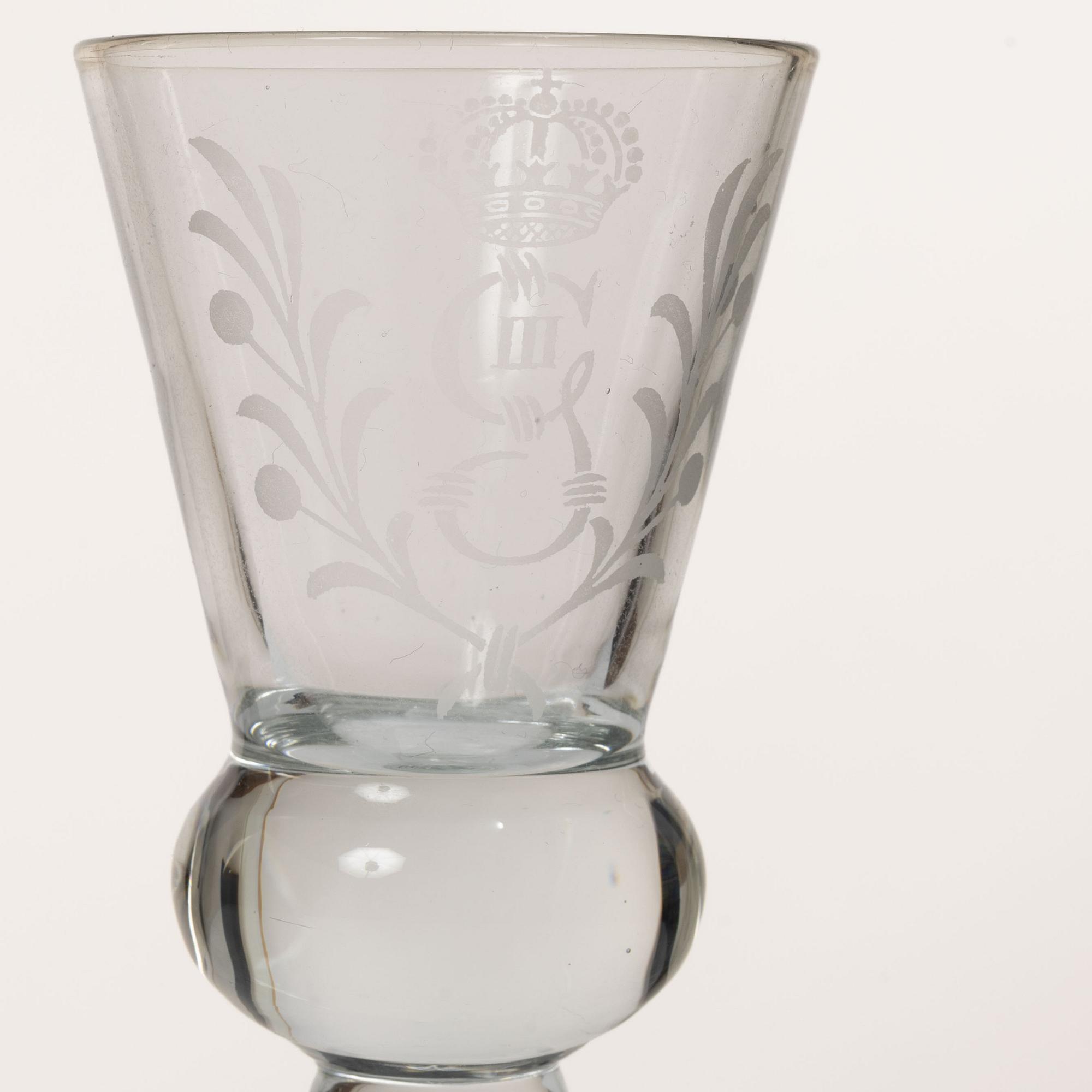 A set of 12 schnaps glasses by Reijmyre Glassworks with king Gustav III emblem.