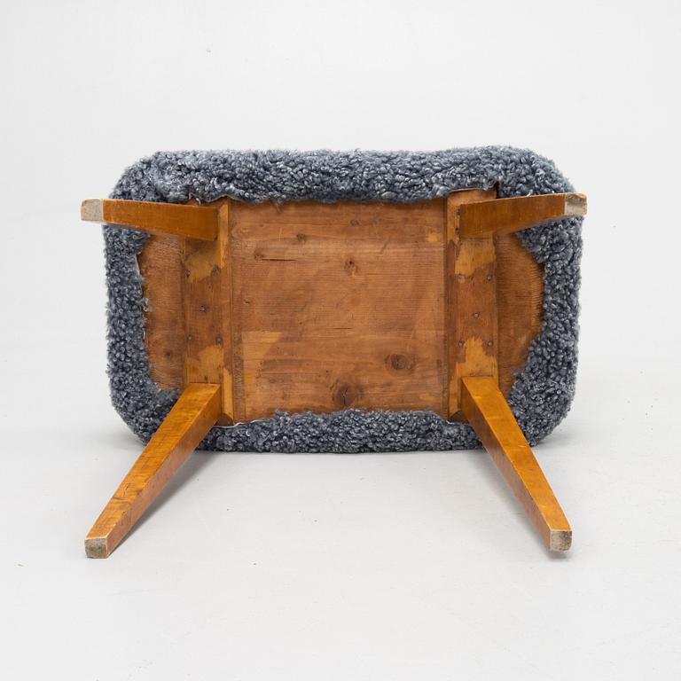 A mid 20th Century birch stool .