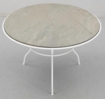 An Olle Rex lackered iron table with gray schist top by Svenskt Tenn.