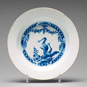 915. A set of eight blue and white armorial soup dishes, Qing dynasty, 18th Century.