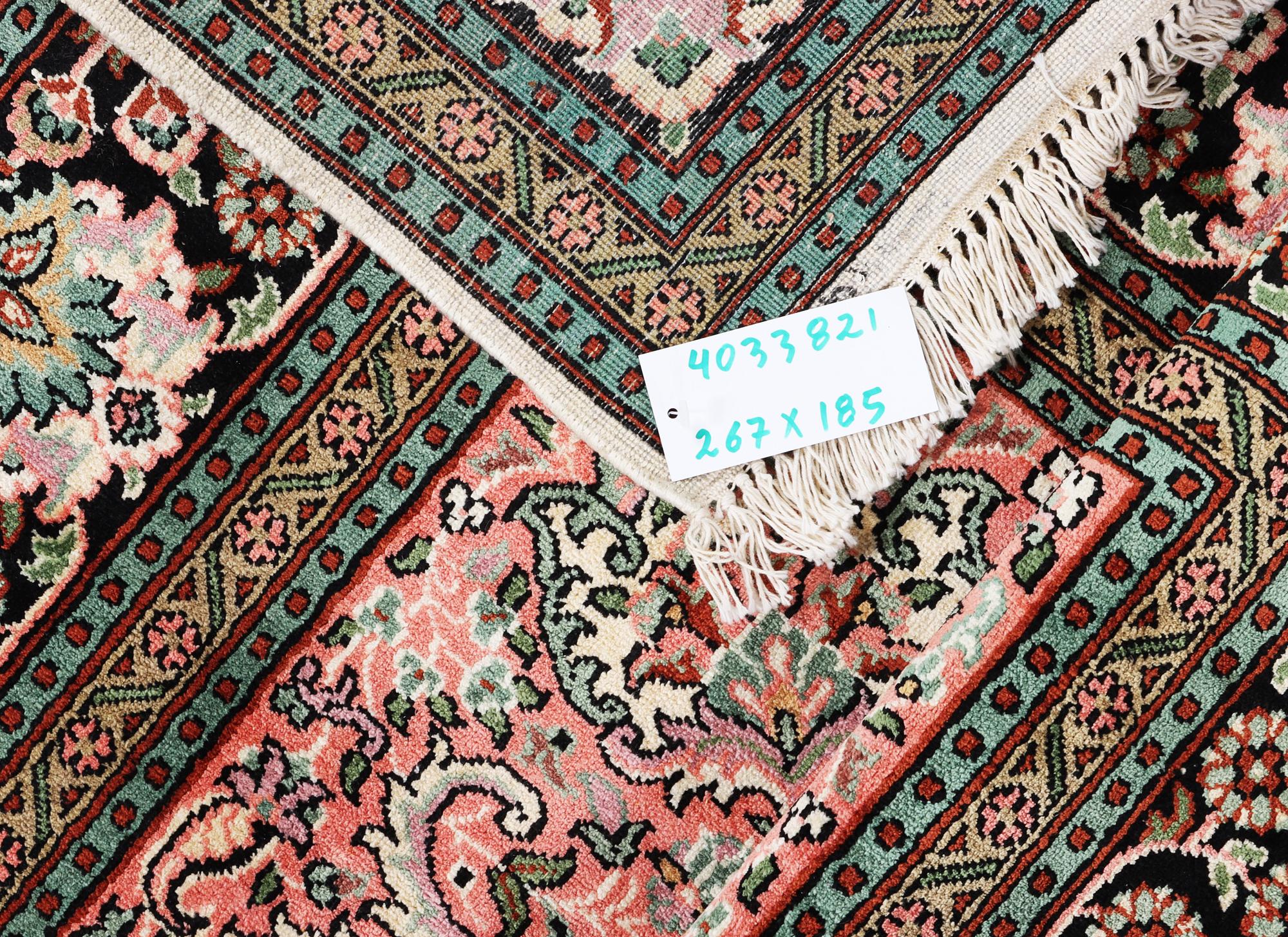 A silk Kashmir carpet, c. 267 x 185 cm.