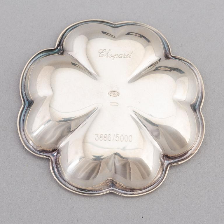 De Grisogono, a set of five silver dishes, Chopard, Switzerland.