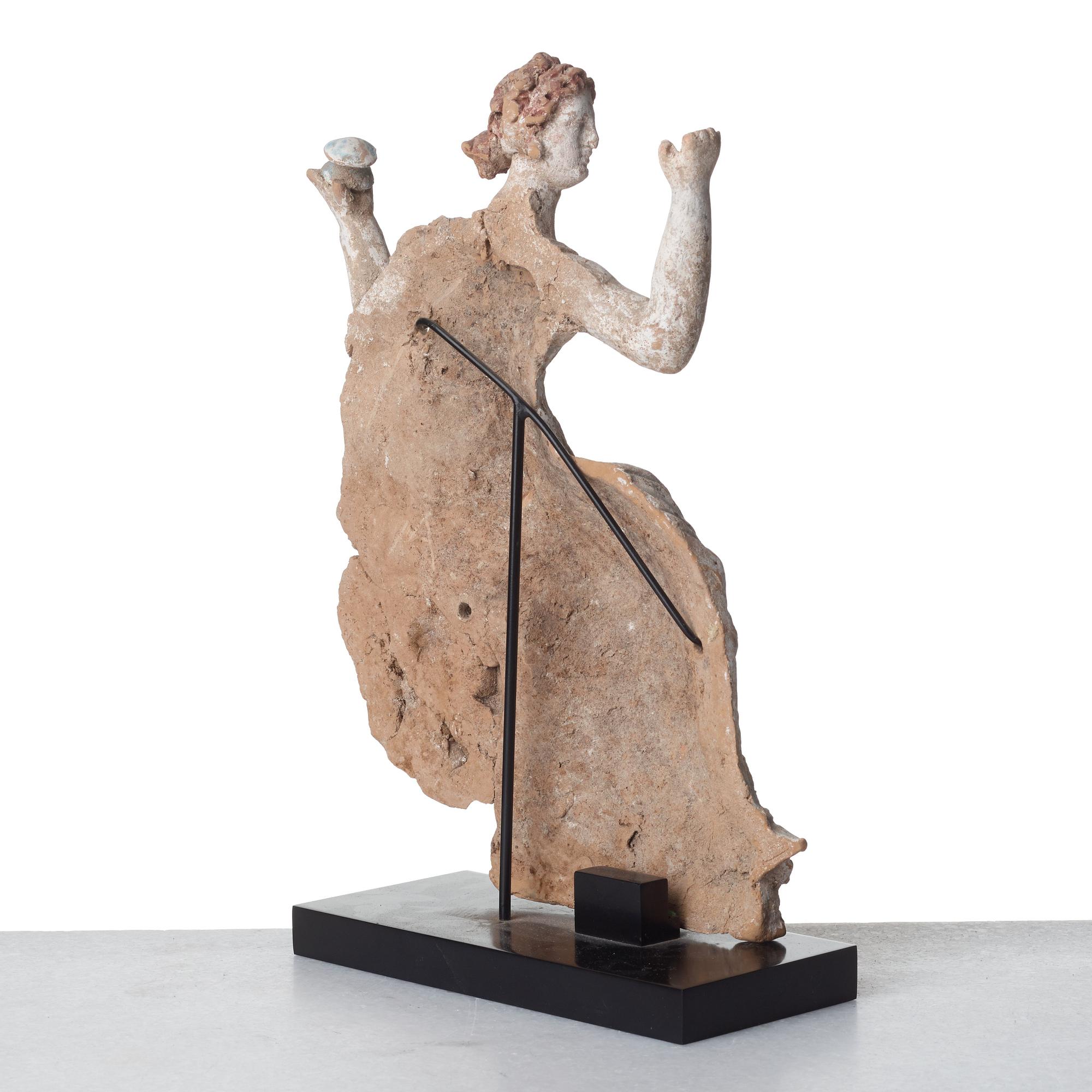 A Greek pottery sculpture of a seated lady, Hellenistic, probably circa 2nd Century B.C.