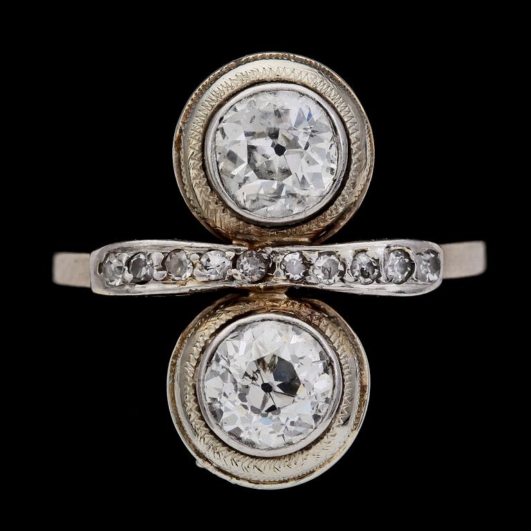 An old cut diamond ring, app. 1 cts each stone.