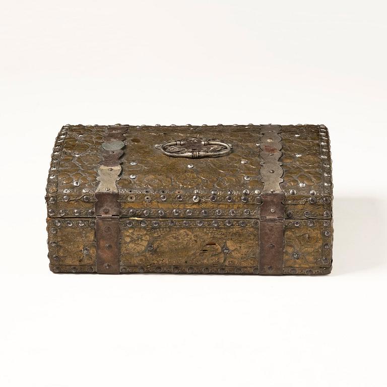 A presumably German baroque repoussé brass writing box, late 17th century.