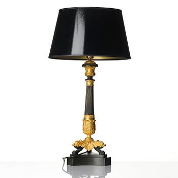 A French Louis Philippe ormolu and patinated bronze lamp, first part 19th century.