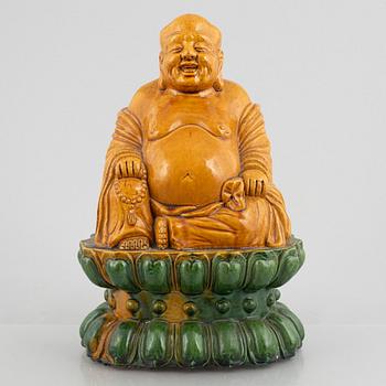 A ceramic Budai, China, 20th century.