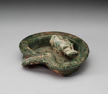 A green glazed heart shaped pigsty with pig, Han dynasty (206 BC- 220 AD).