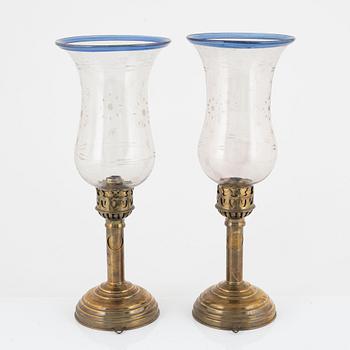 A pair of brass and glass presumably Russian hurricane lamps, later part of the 19th century.