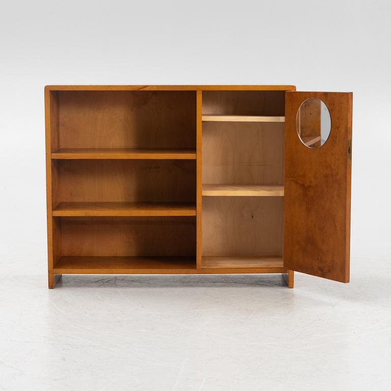 A birch wood book case with cabinet, 1930s.