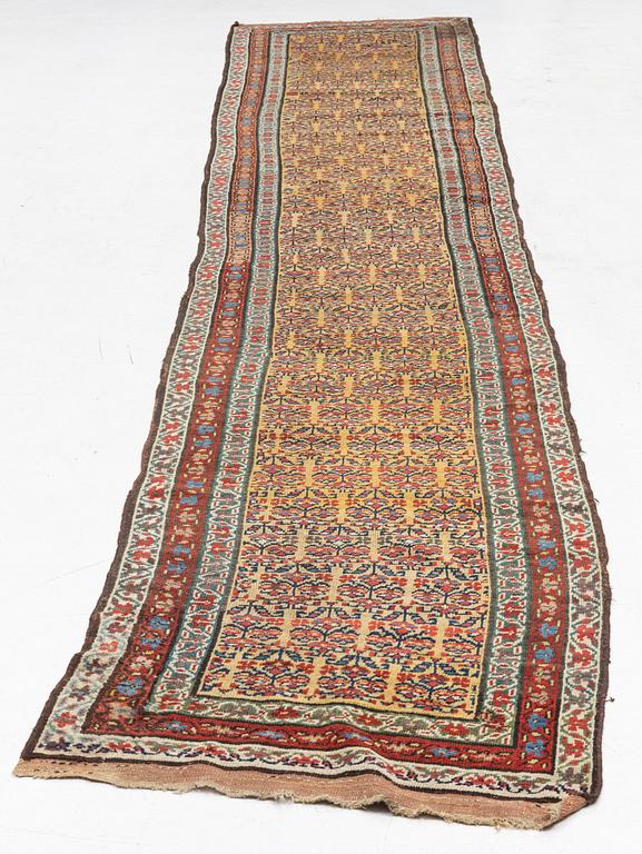 An antique Kurdish runner, c 460 x 84 cm.