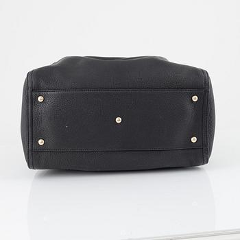 Gucci, a black leather handbag.