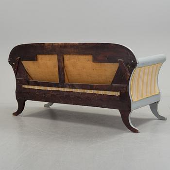 A mid 19th century painted sofa.