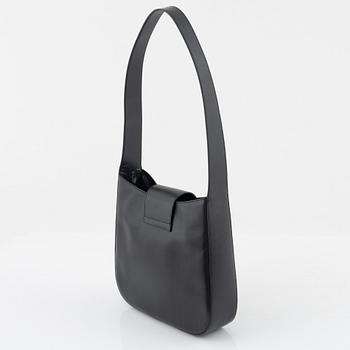 Prada, a dark grey leather bag.