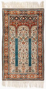 An oriental silk rug, probably China, c. 154 x 93 cm.