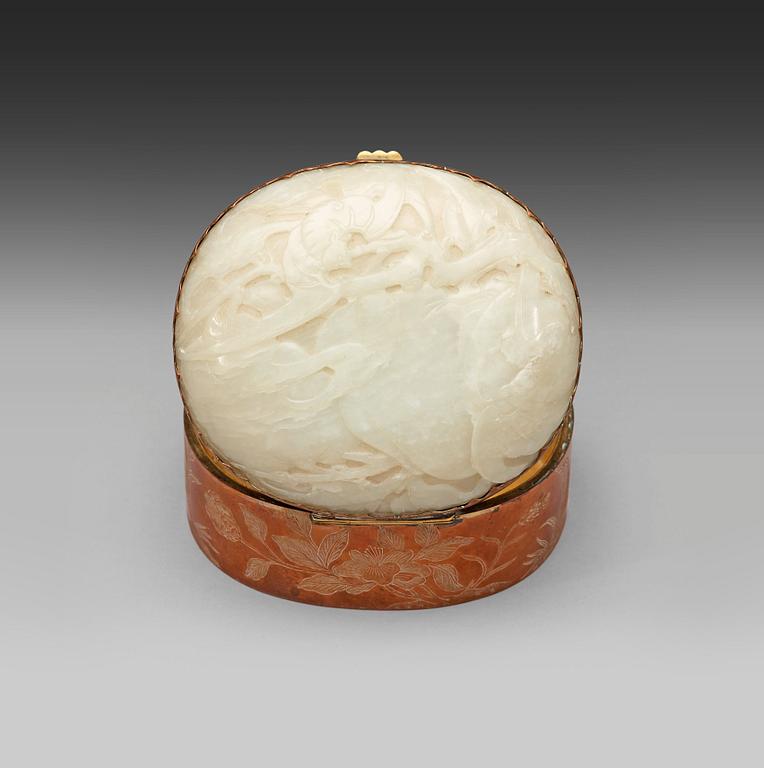 A metal box with cover with a large carved jade plaque, China early 20th Century.