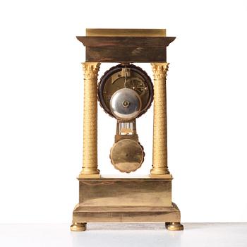 A Empire early 19th century gilt bronze mantel clock.