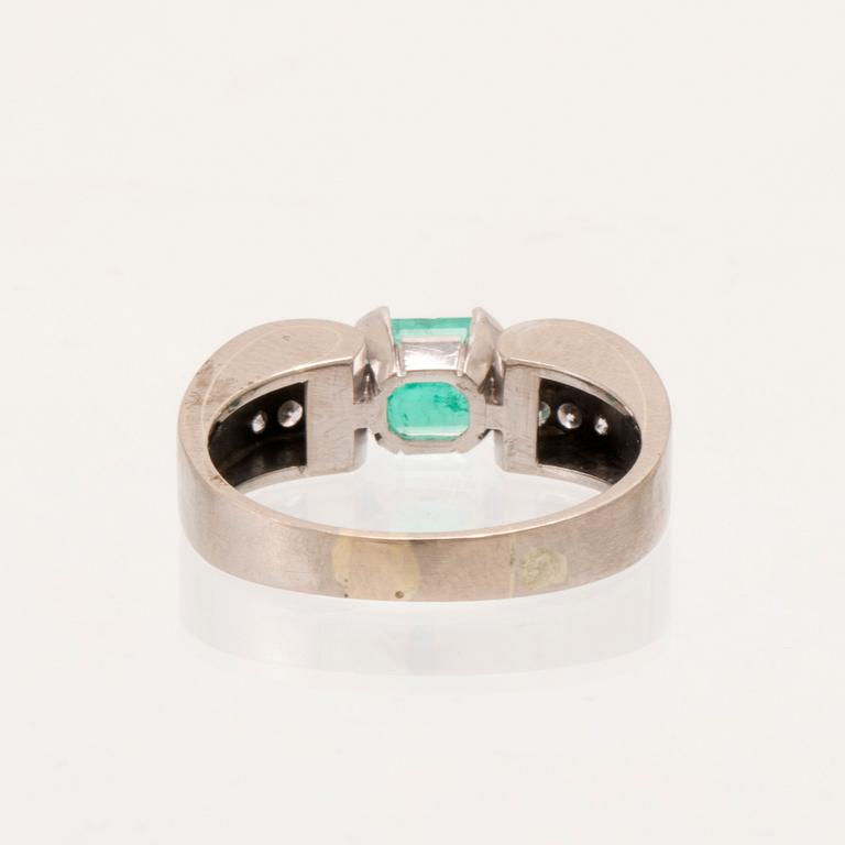 W.A. Bolin, ring 18K white gold with a rectangular step-cut emerald and round brilliant-cut diamonds, Stockholm 1976.