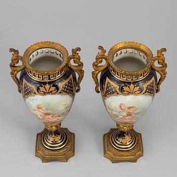 A pair of French urns, 20th century.