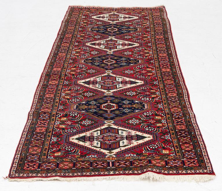 An oriental runner carpet, c. 266 x 89 cm.