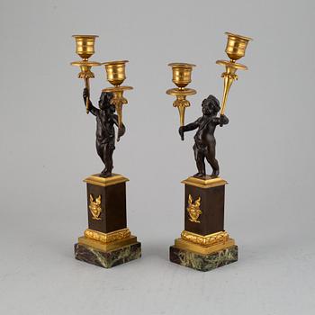 A pair of bronze empire style candleabra, 20th century.