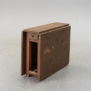 A 19th century painted gate leg table.