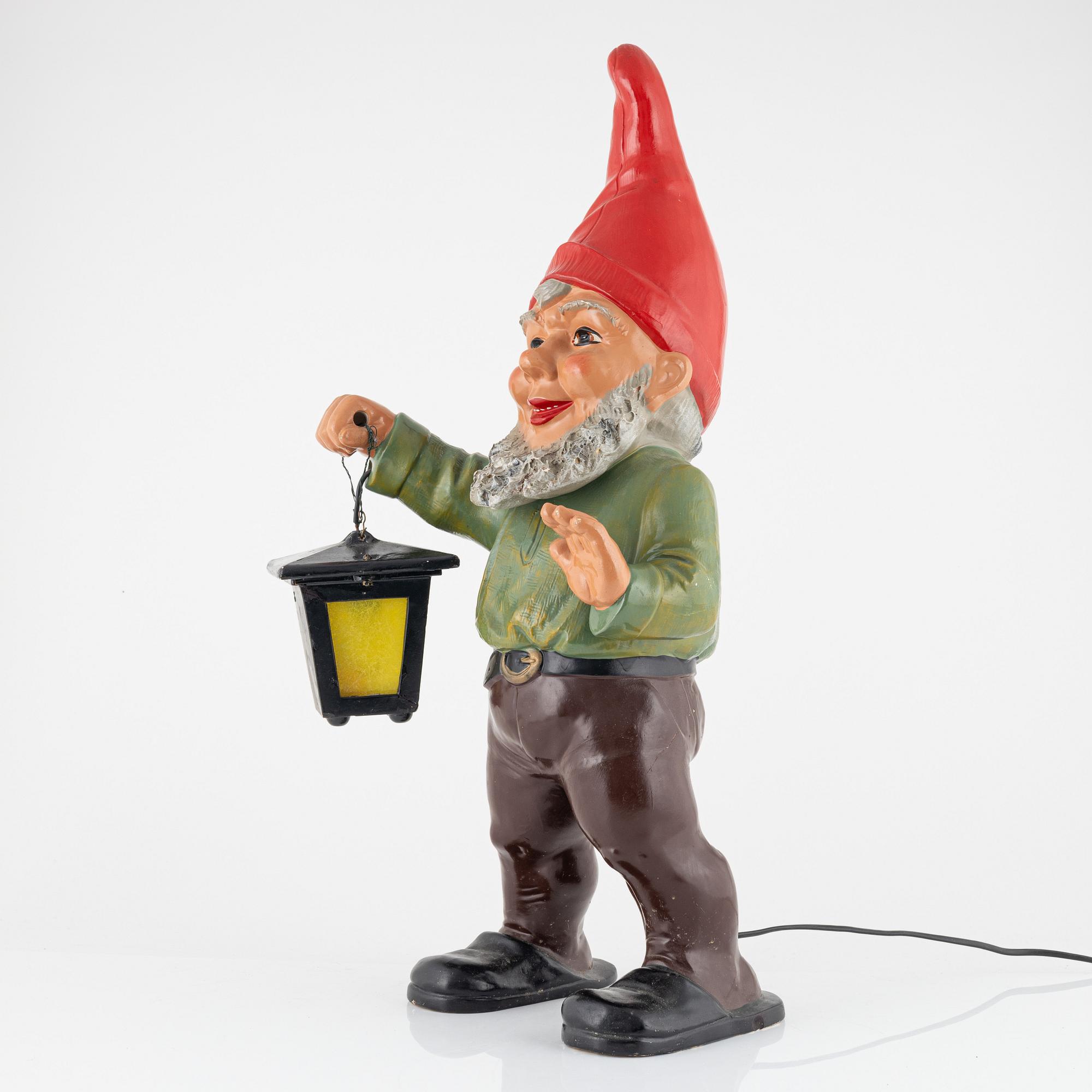 A West German earthenware gnome figurine with lantern from the second half of the 20th century.