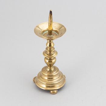 A 16th century bronze candlestick.