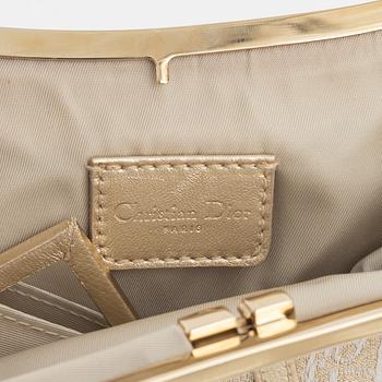 Christian Dior, A vintage 'Mini saddle clutch'.