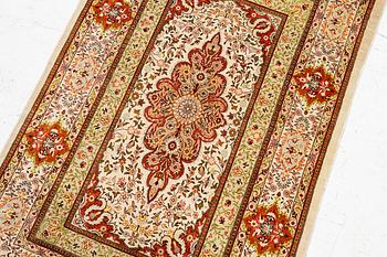 A Hereke silk rug, West Anatolia, c. 107 x 69 cm.