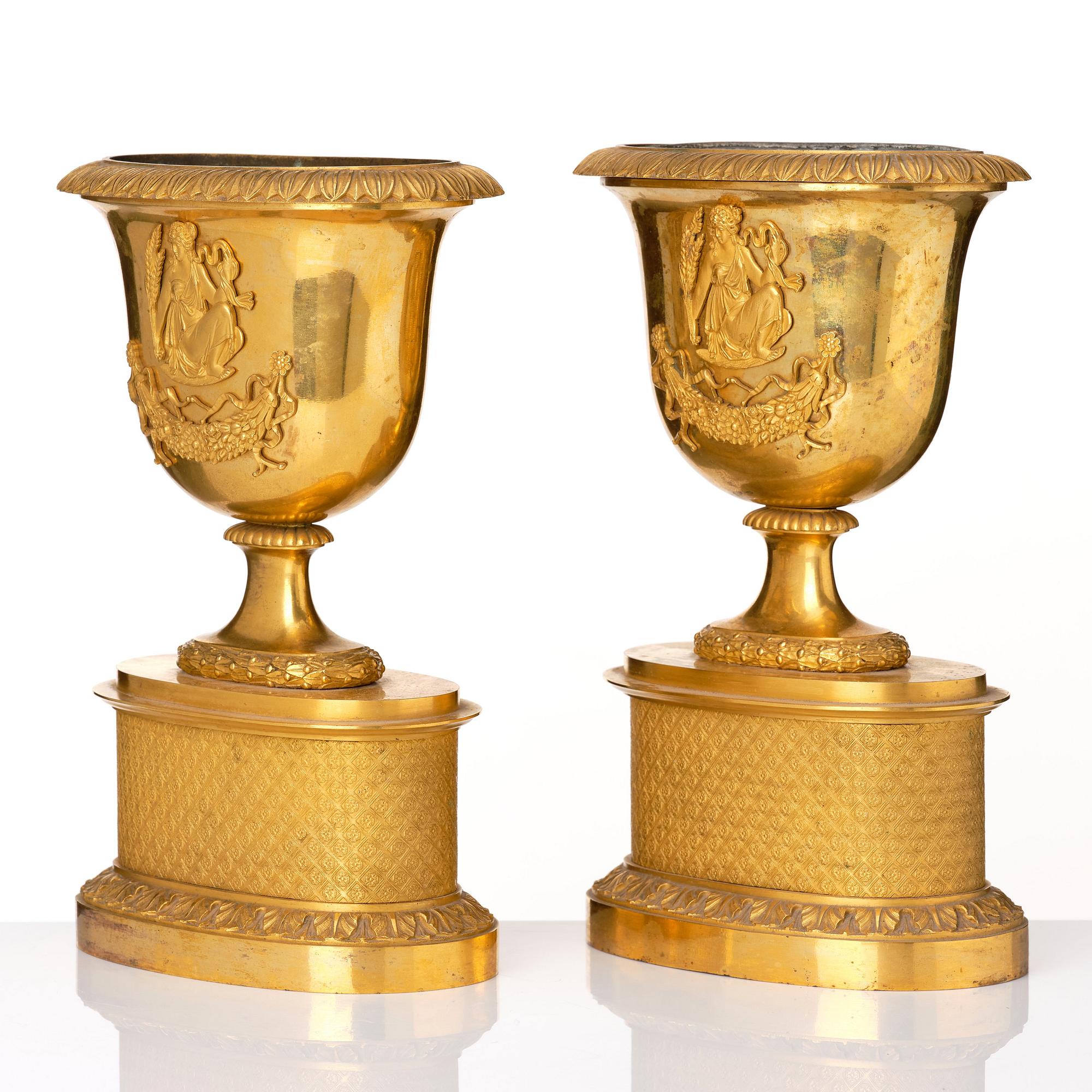 A set of three French Empire early 19th century gilt bronze centre pieces.