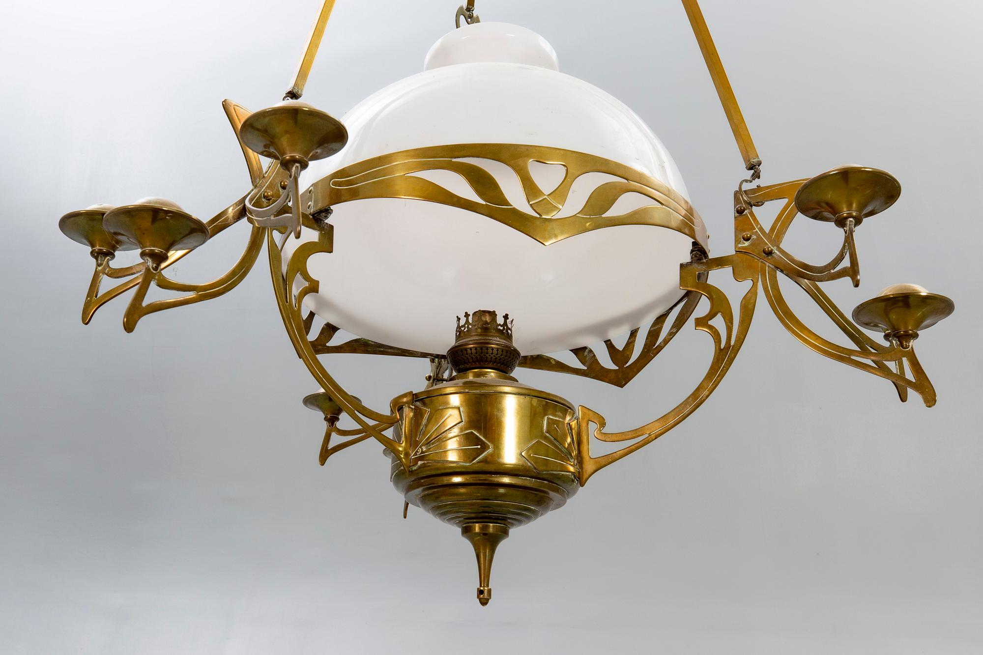 A Jugend brass celing paraffin lamp.