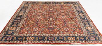 An antique/semi antique Tabriz carpet, c. 325 x 229 cm.