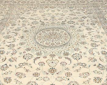 A carpet, Nain, part silk s.k 9LAA. Circa 376 x 249 cm.