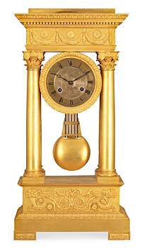 632. A French Empire early 19th century gilt bronze mantel clock.