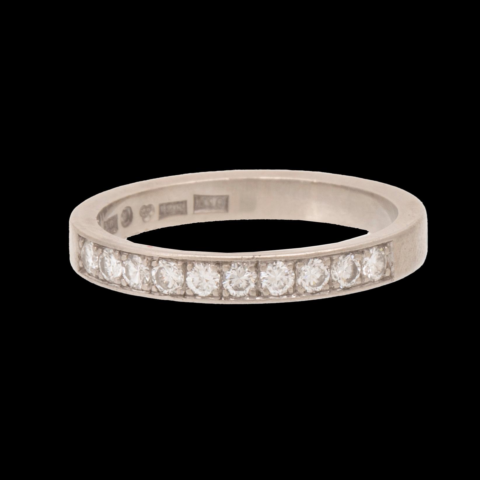 An 18K white gold half eternity ring set with round brilliant-cut diamonds.