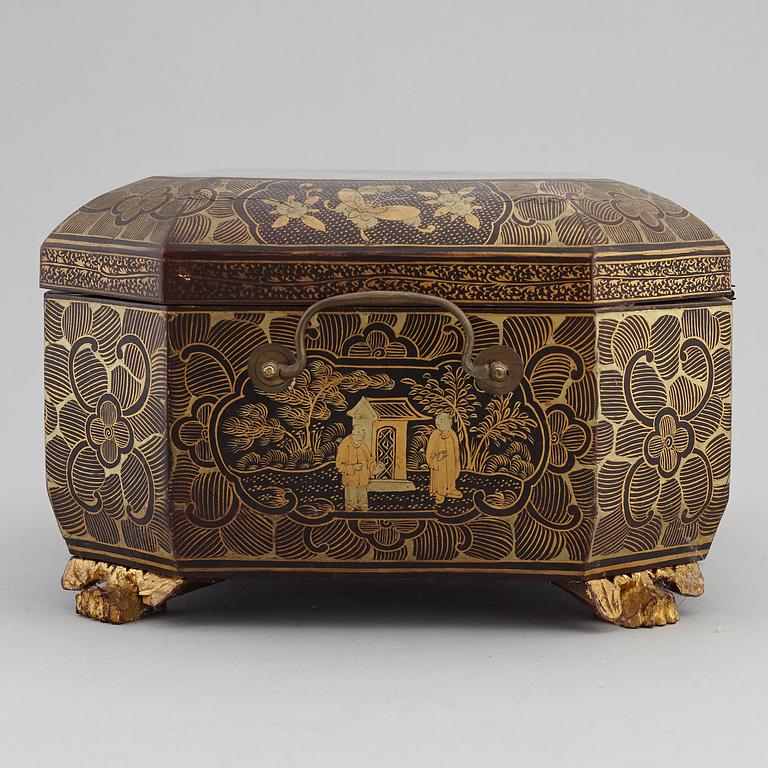 A lacquered sewing cabinet, Qing dynasty, 19th century.